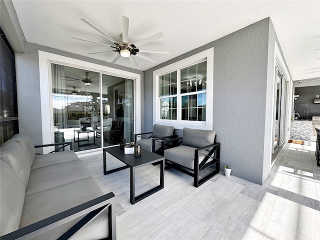 view of patio featuring an outdoor living space and ceiling fan