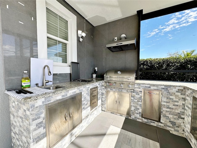 view of patio with a grill, sink, and an outdoor kitchen