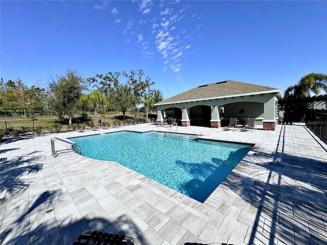 view of pool featuring a patio