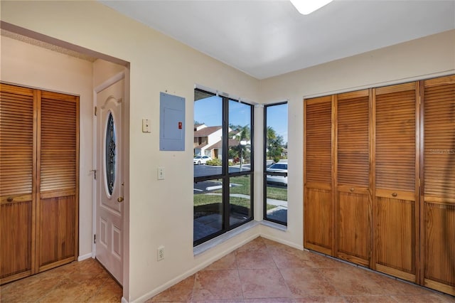 3002 Clubview Dr, Orlando, FL 32822 - entrance foyer featuring electric panel, light tile patterned floors, and baseboards