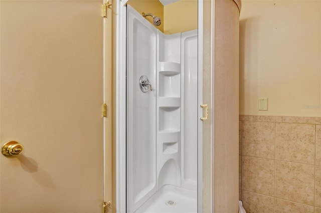 3002 Clubview Dr, Orlando, FL 32822 - full bathroom with a shower stall and wainscoting