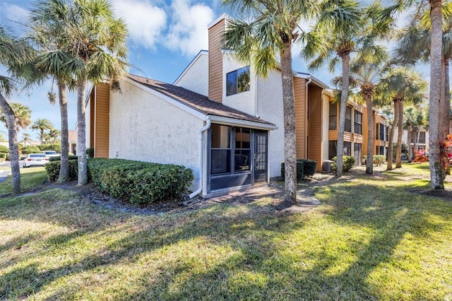 3002 Clubview Dr, Orlando, FL 32822 - back of property with stucco siding, a lawn, and a chimney
