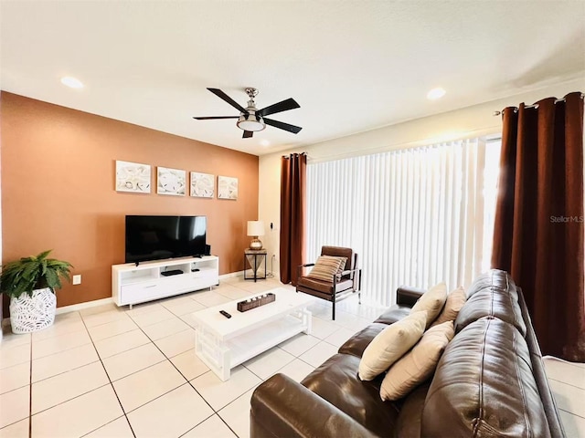 living room featuring recessed lighting, light tile patterned floors, a ceiling fan, and baseboards