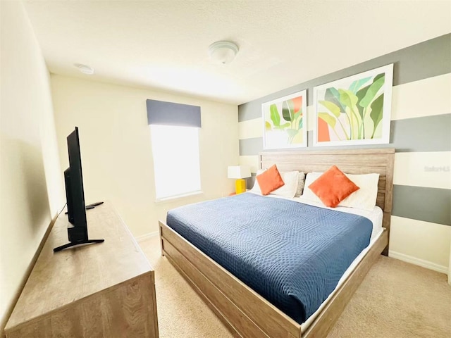 bedroom featuring carpet flooring and baseboards