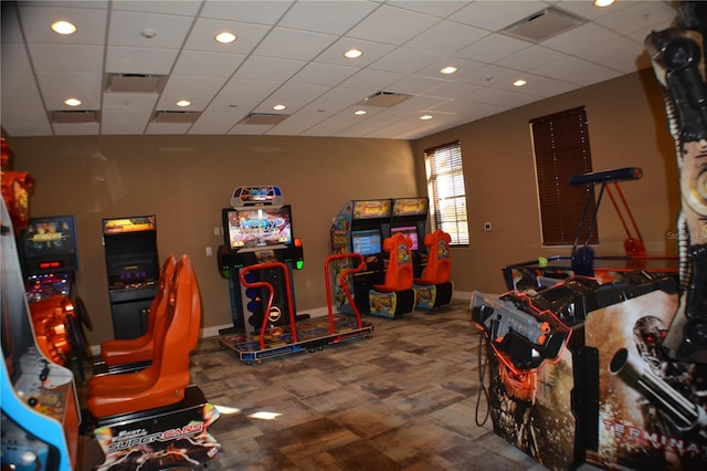 game room with recessed lighting, baseboards, visible vents, and a drop ceiling