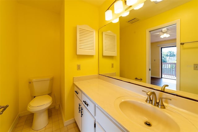 half bathroom with baseboards, visible vents, toilet, tile patterned floors, and vanity