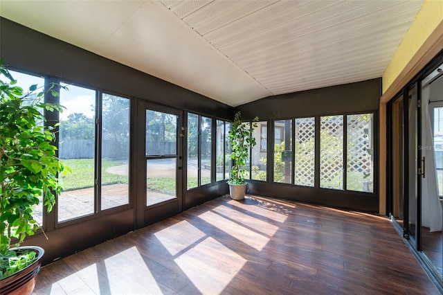 unfurnished sunroom with vaulted ceiling and plenty of natural light