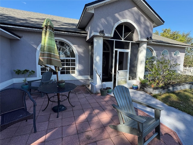 rear view of property featuring a patio area