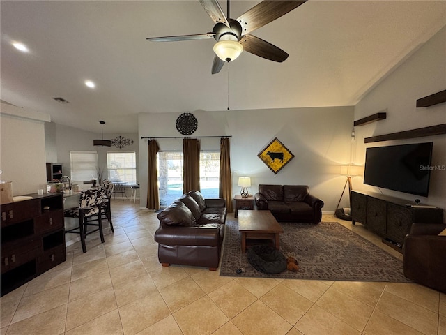 tiled living room with vaulted ceiling and ceiling fan