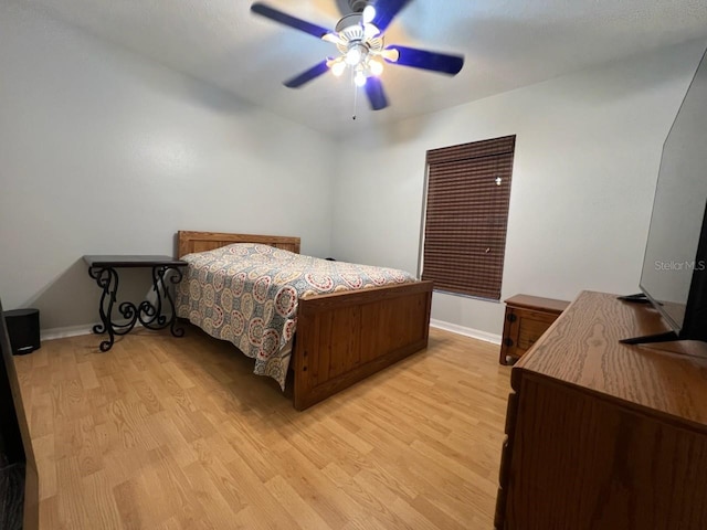 bedroom featuring ceiling fan and light wood-type flooring