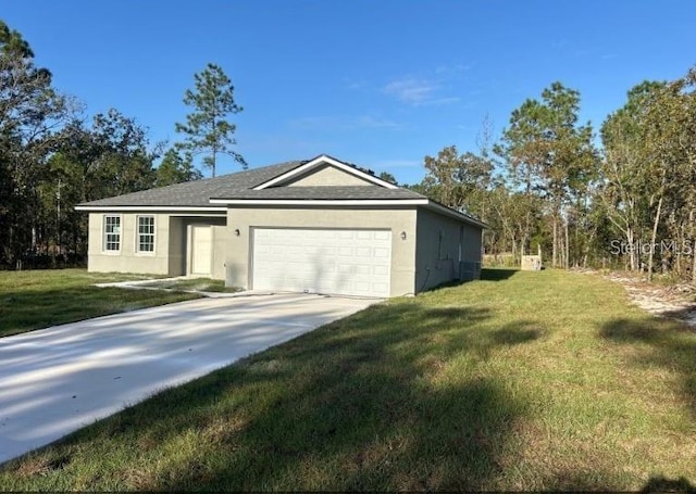 exterior space featuring a garage, a yard, and cooling unit