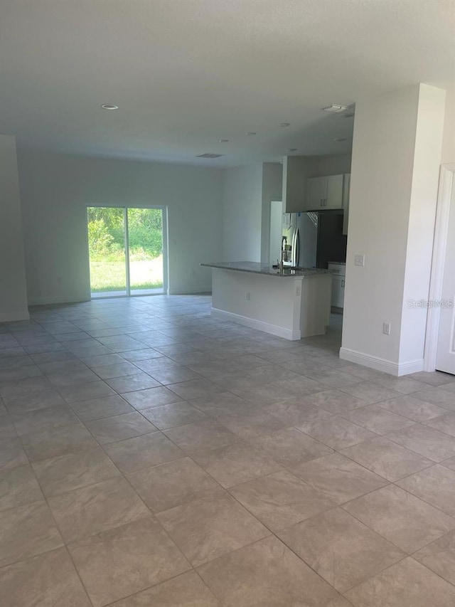 interior space featuring light tile patterned floors