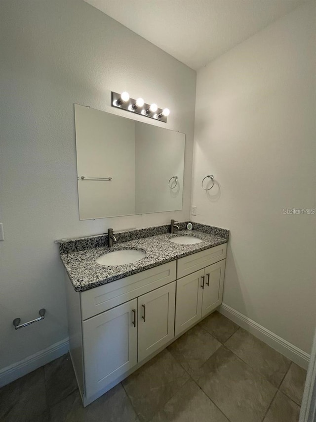 bathroom with vanity and tile patterned floors