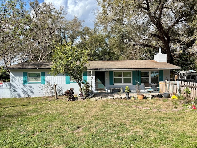 807 Richbee Dr, Altamonte Springs, FL 32714 - ranch-style house with a chimney, fence, and a front yard