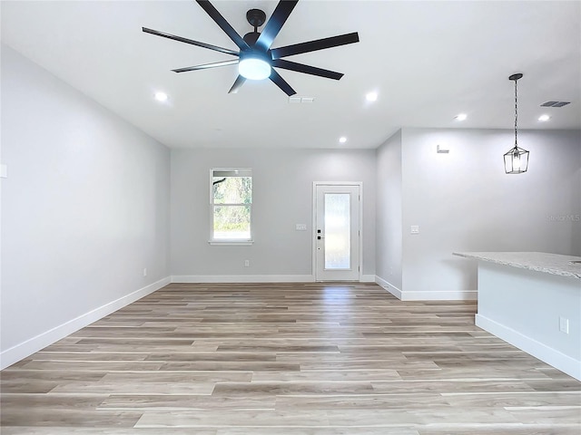 interior space featuring ceiling fan and light hardwood / wood-style floors