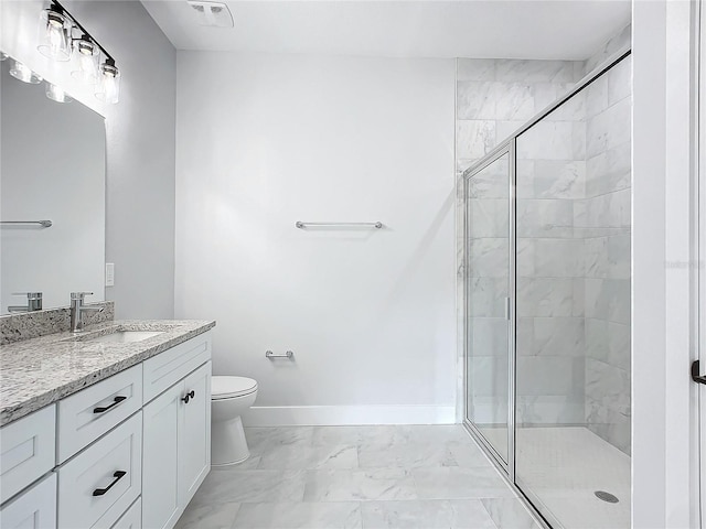 bathroom with vanity, toilet, and walk in shower