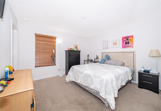 bedroom featuring light colored carpet