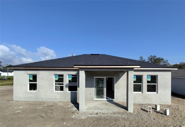 back of house with a patio