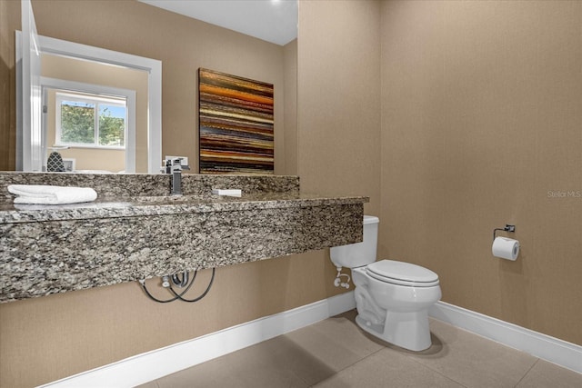 bathroom with tile patterned flooring and toilet