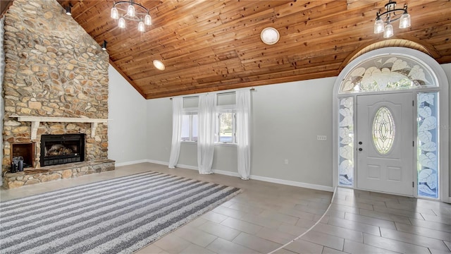 entrance foyer featuring tile patterned floors, high vaulted ceiling, a stone fireplace, wooden ceiling, and a chandelier