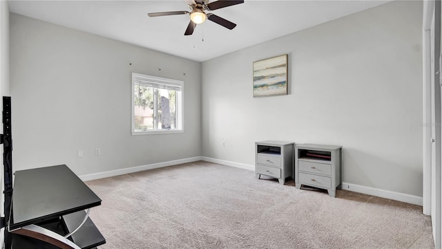 interior space with ceiling fan and light carpet