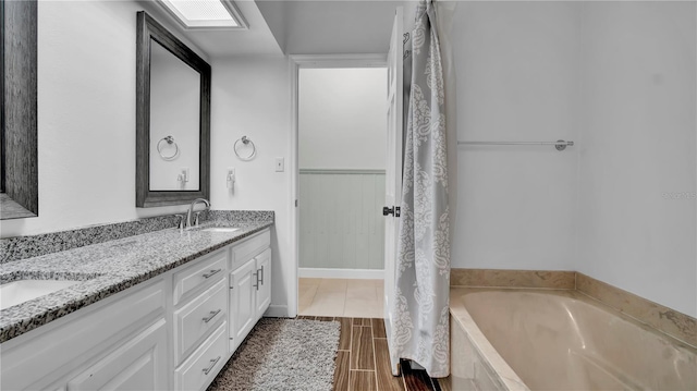 bathroom featuring vanity and a bathtub