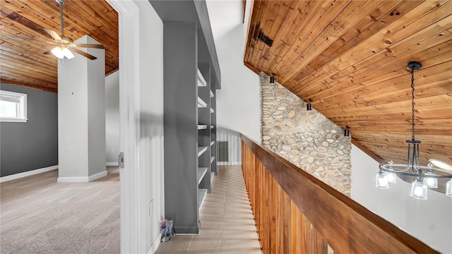 bonus room featuring wood ceiling, high vaulted ceiling, and light carpet