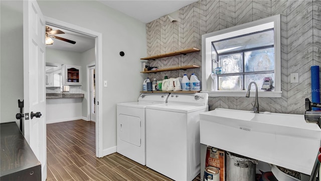 laundry room with separate washer and dryer, sink, and ceiling fan