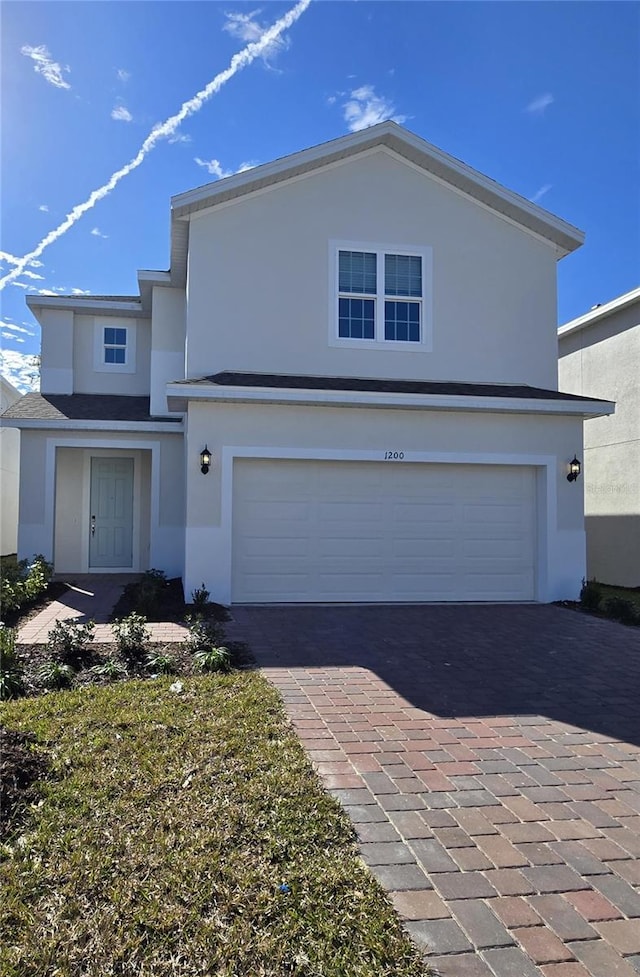 front facade with a garage