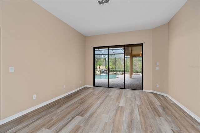 unfurnished room featuring light wood-type flooring