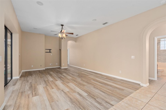 spare room featuring light hardwood / wood-style flooring and ceiling fan