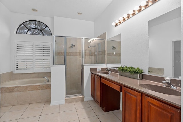 bathroom with tile patterned flooring, vanity, and separate shower and tub