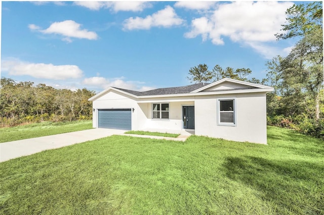 single story home featuring a garage and a front lawn