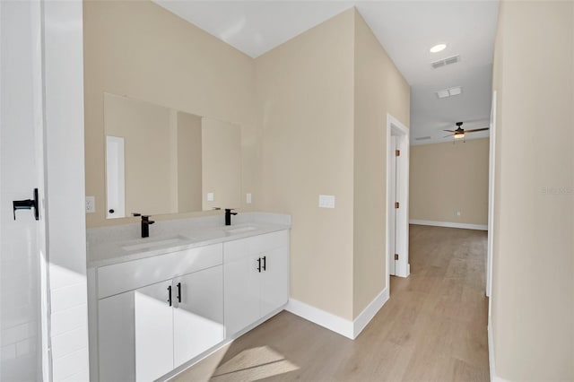 bathroom featuring vanity and wood-type flooring