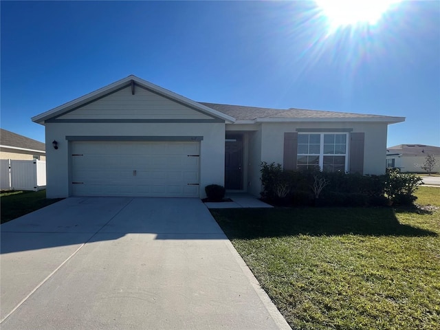 single story home with a garage and a front yard