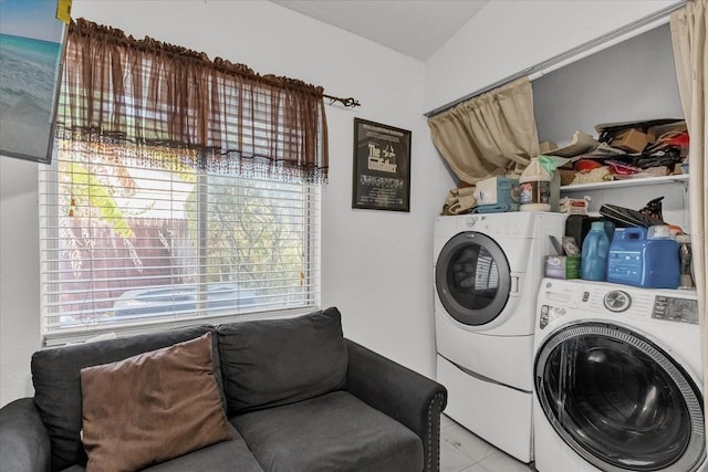 laundry room with light tile patterned floors and independent washer and dryer