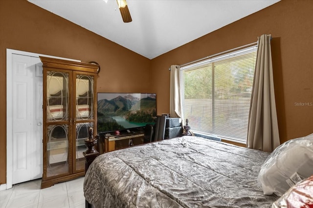 bedroom with lofted ceiling and ceiling fan