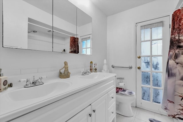 bathroom featuring vanity, walk in shower, and toilet