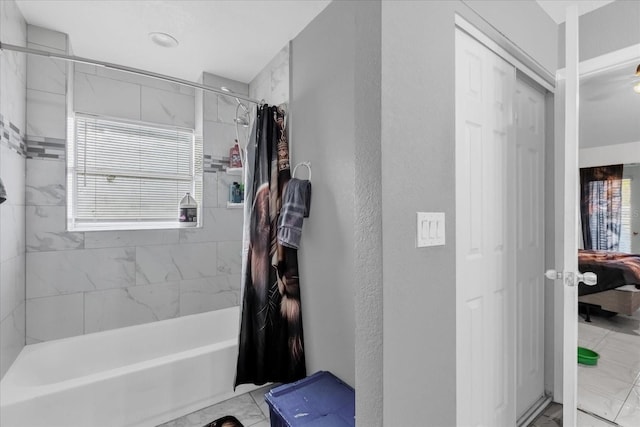 bathroom with shower / bath combination with curtain