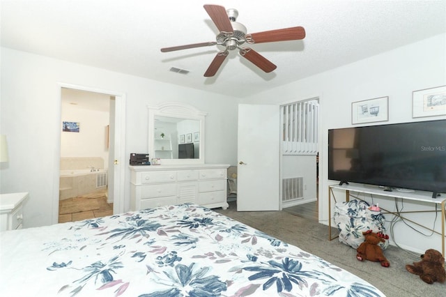 bedroom with ensuite bath and ceiling fan