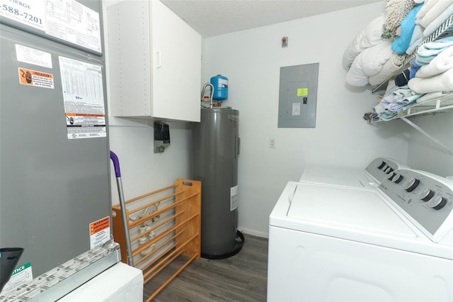 clothes washing area featuring a textured ceiling, dark hardwood / wood-style floors, electric panel, electric water heater, and washing machine and dryer