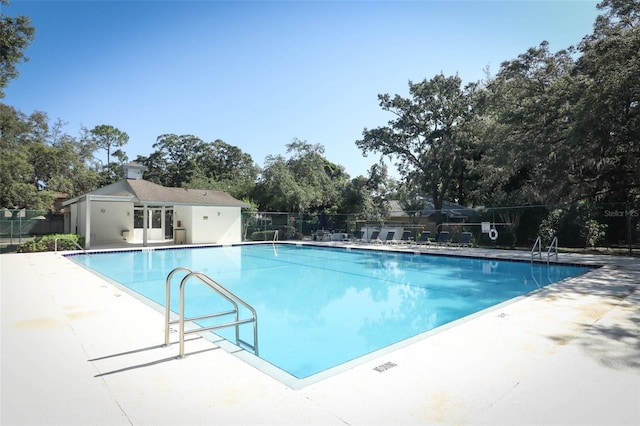 view of swimming pool with a patio area