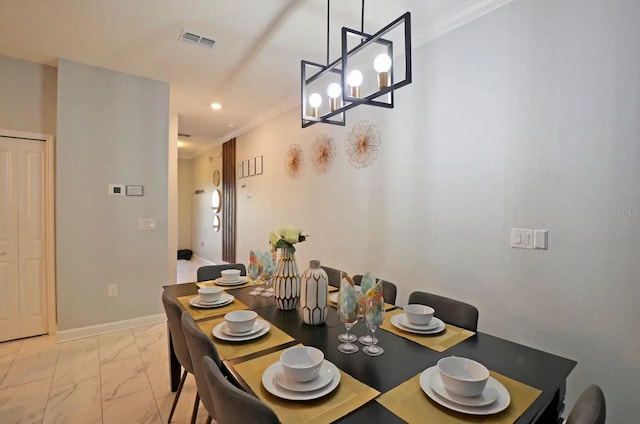 dining area with ornamental molding