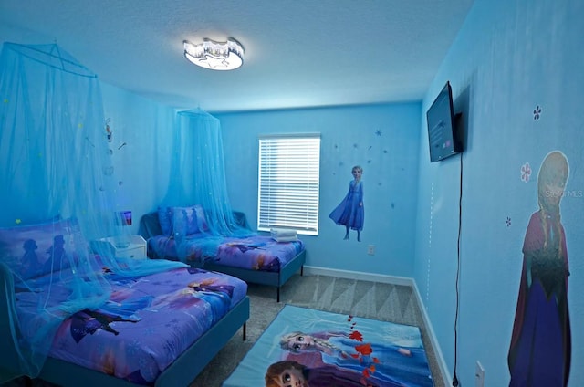 carpeted bedroom featuring a textured ceiling