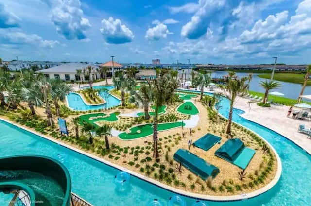 view of pool featuring a water view