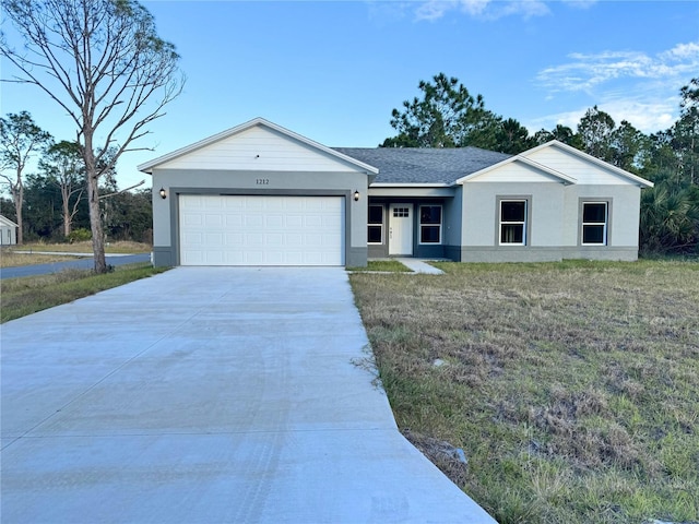 ranch-style house featuring a garage and a front yard