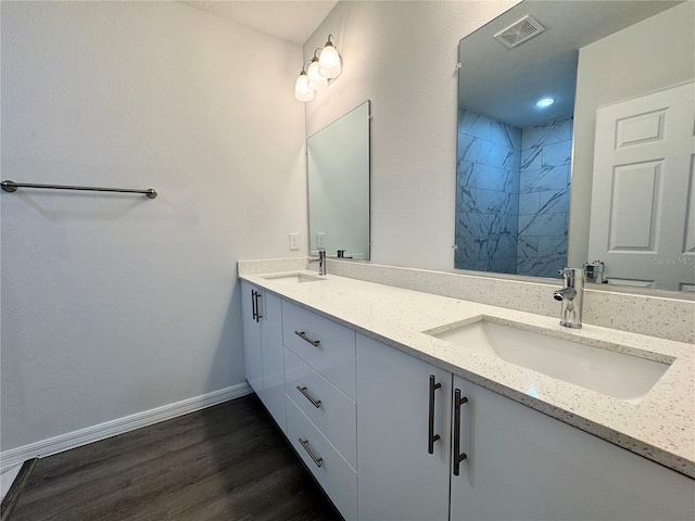 bathroom featuring vanity and wood-type flooring