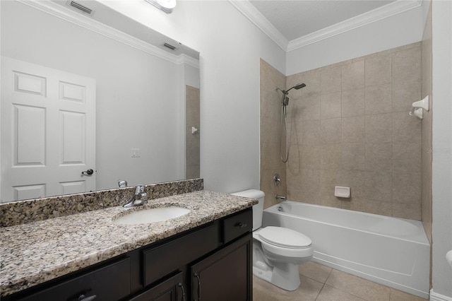 full bathroom featuring tile patterned floors, toilet, tiled shower / bath, ornamental molding, and vanity