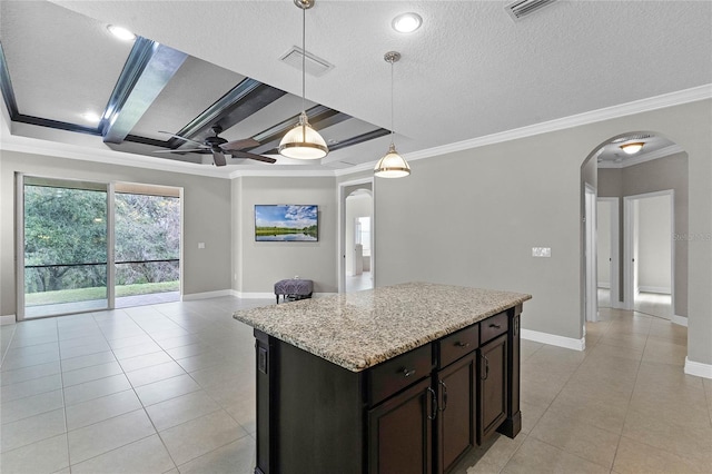 kitchen featuring pendant lighting, dark brown cabinetry, crown molding, and a textured ceiling