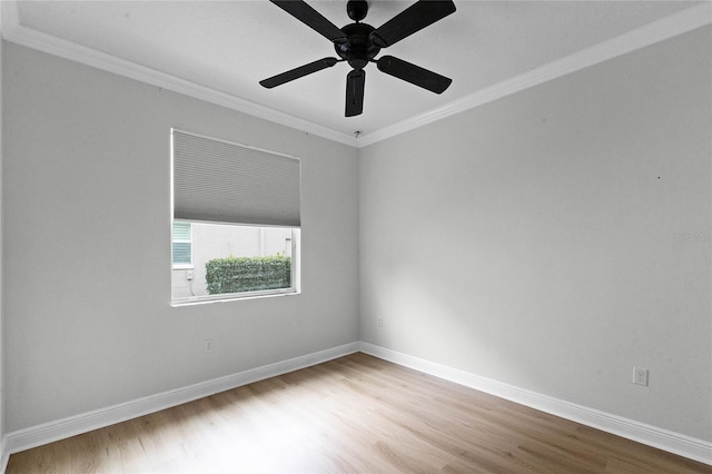 empty room with ornamental molding, ceiling fan, and light hardwood / wood-style floors